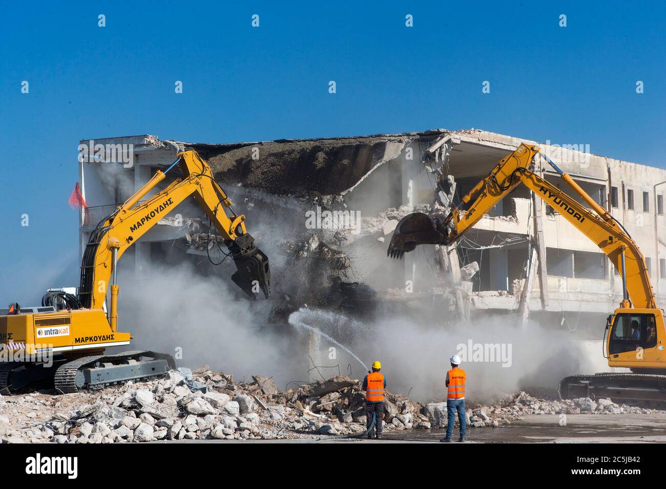 Athens, Greece. 3rd July, 2020. Bulldozers demolish a derelict building at the 'Hellinikon' airport, in Athens, Greece, on July 3, 2020. Greek Prime Minister Kyriakos Mitsotakis welcomed the start of construction works at Athens' former airport 'Hellinikon' on Friday under an emblematic redevelopment project as the 'beginning of a new era' for Greece. Credit: Marios Lolos/Xinhua/Alamy Live News Stock Photo