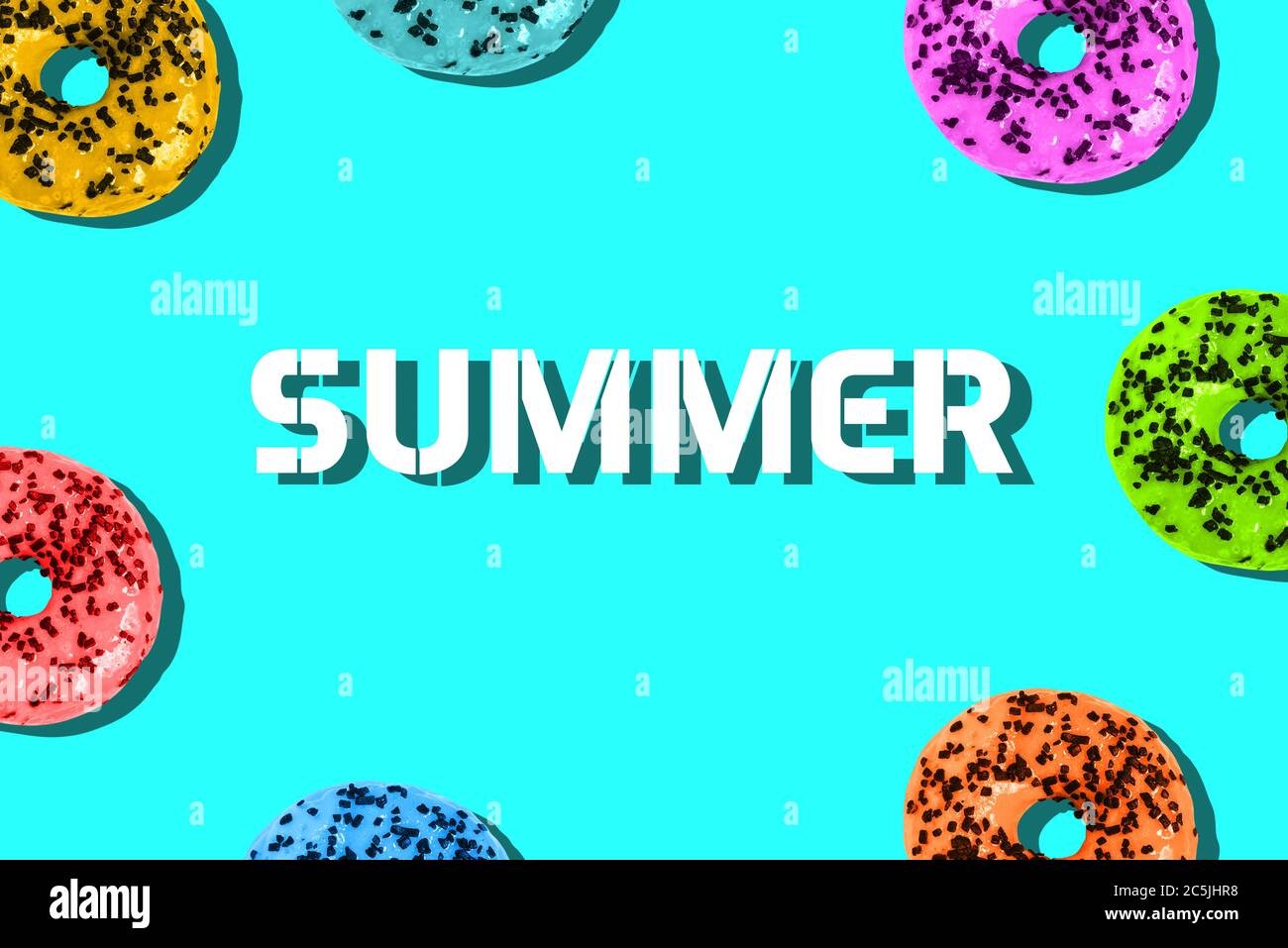 Colorful donuts on a colored background and summer text. Minimum summer template Stock Photo