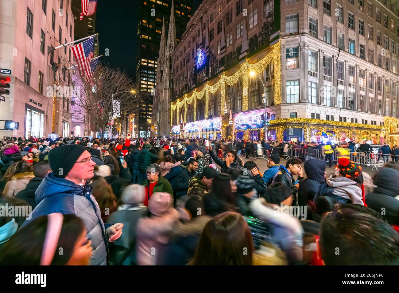 Crowd of people stays to watch the SAKS FIFTH AVENUE Christmas Light