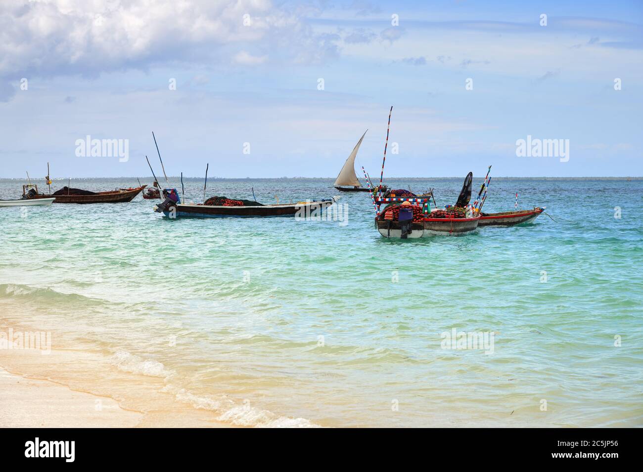 Fishing boats moored near beach at dawn, Zanzibar, Tanzania, Africa Stock Photo - Alamy