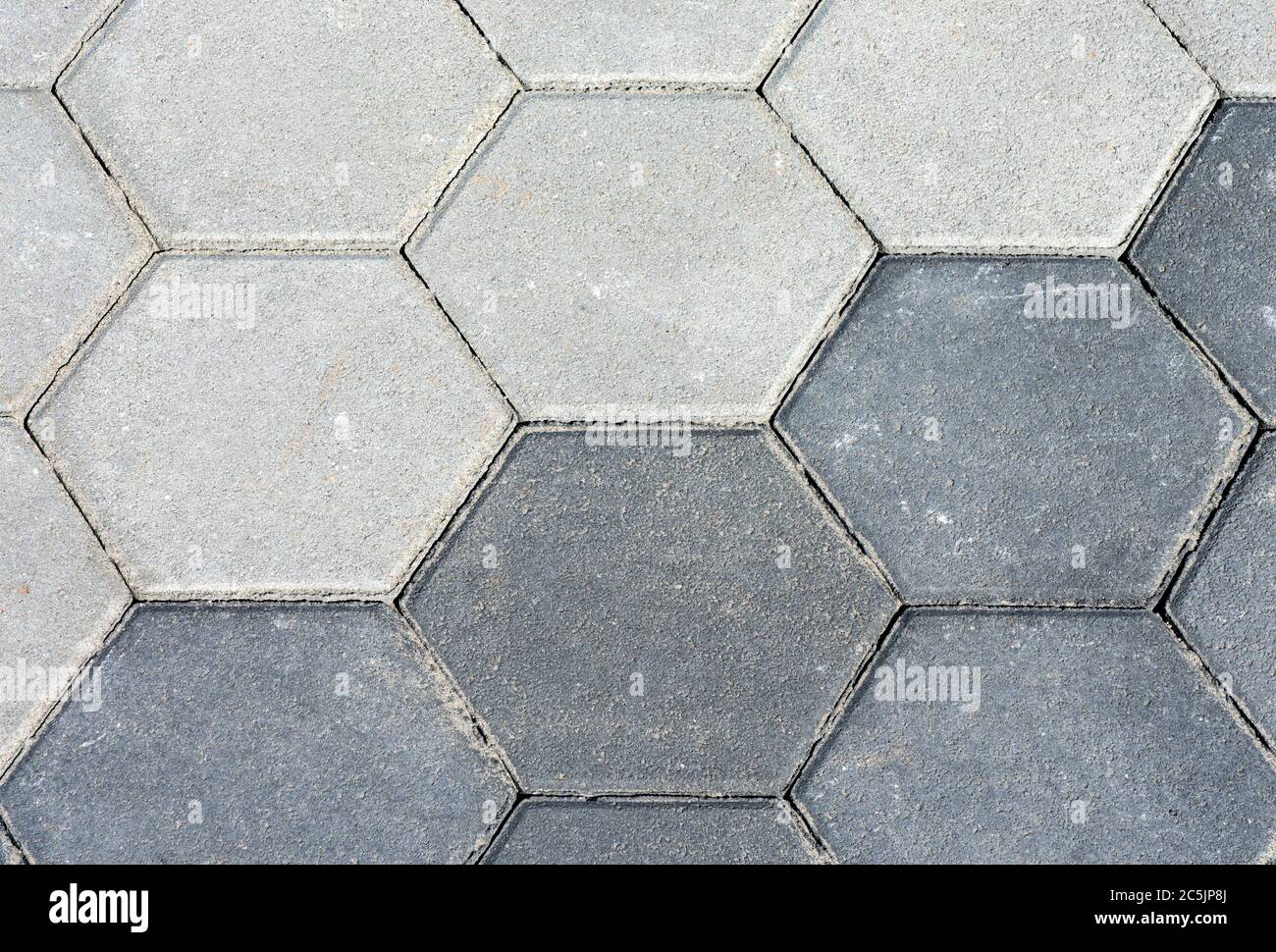 Pavement with two diffent gray hexagon pattern. Cement sidewalk with texture. Background, texture. Stock Photo