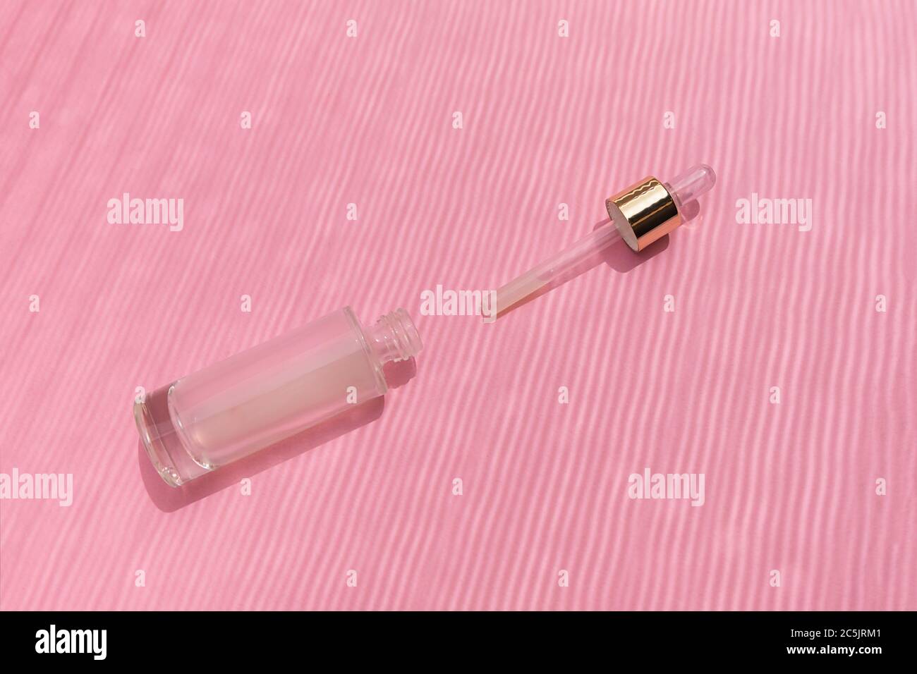 Glass bottle of collagen serum with dropper. Anti aging serum concept Stock Photo