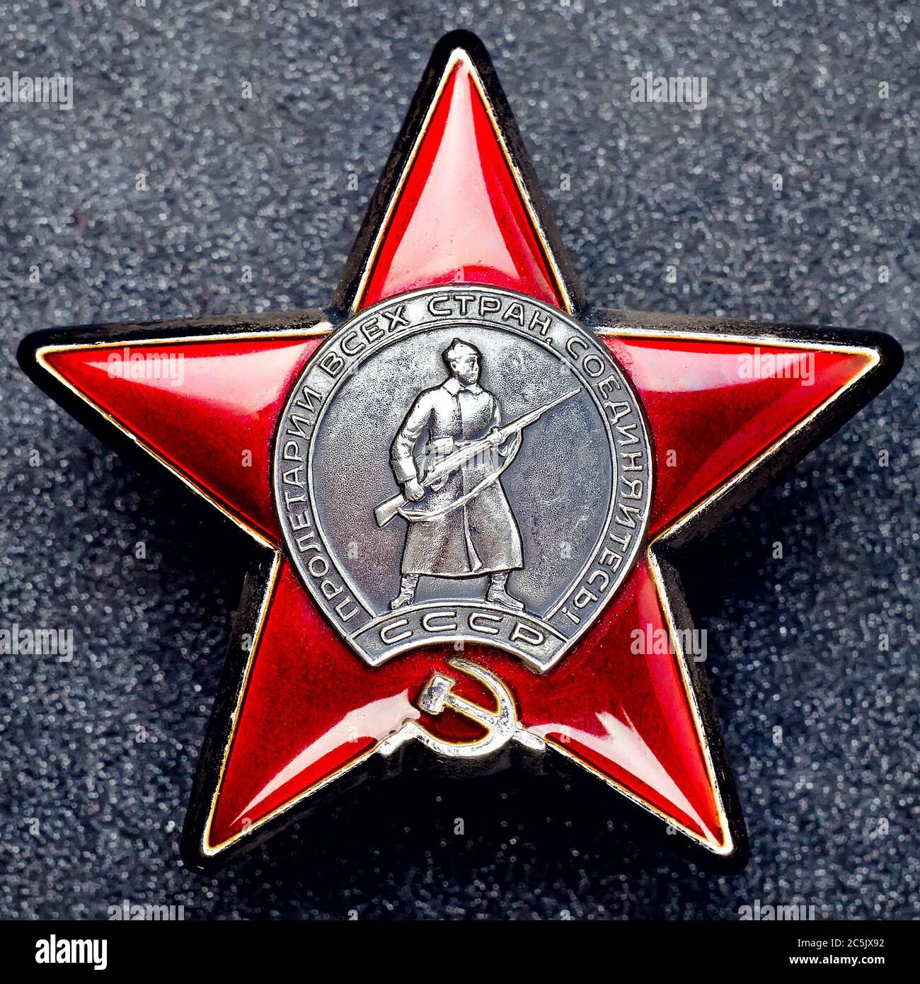 Soviet Order Red Star on granite background Stock Photo