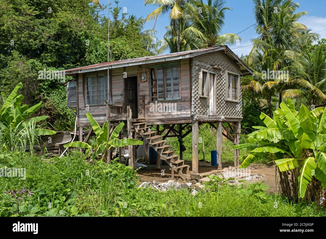 Traditional wooden house on stilts in rural Guyana, South America Stock Photo