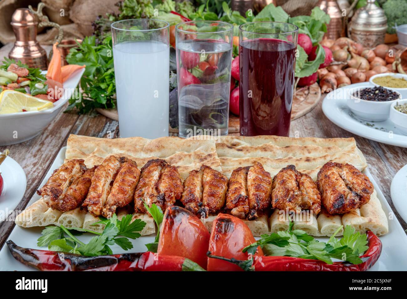 Turkish cuisine chicken wings grill. Heap fried on a grill of chicken