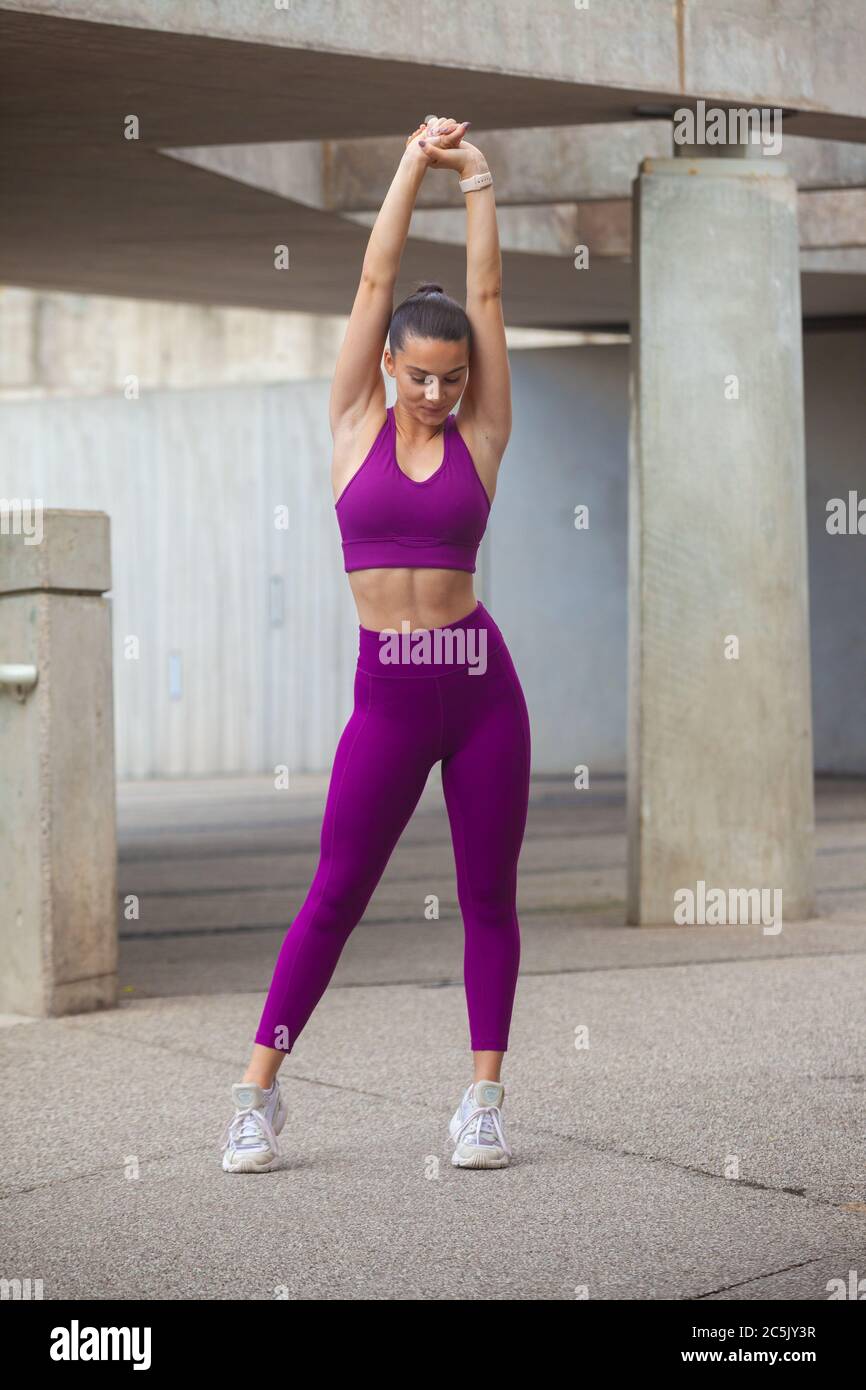 Woman wearing leggings and sports bra 
