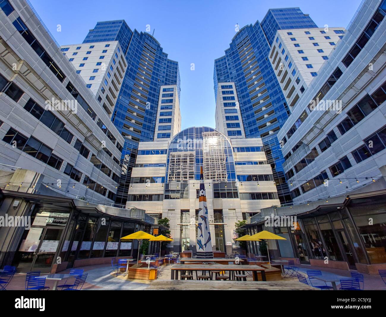 San Francisco, CA, United States - Feb 18, 2019: Google offices at Two Rincon center skyscraper tower bottom up view with blue sky Stock Photo
