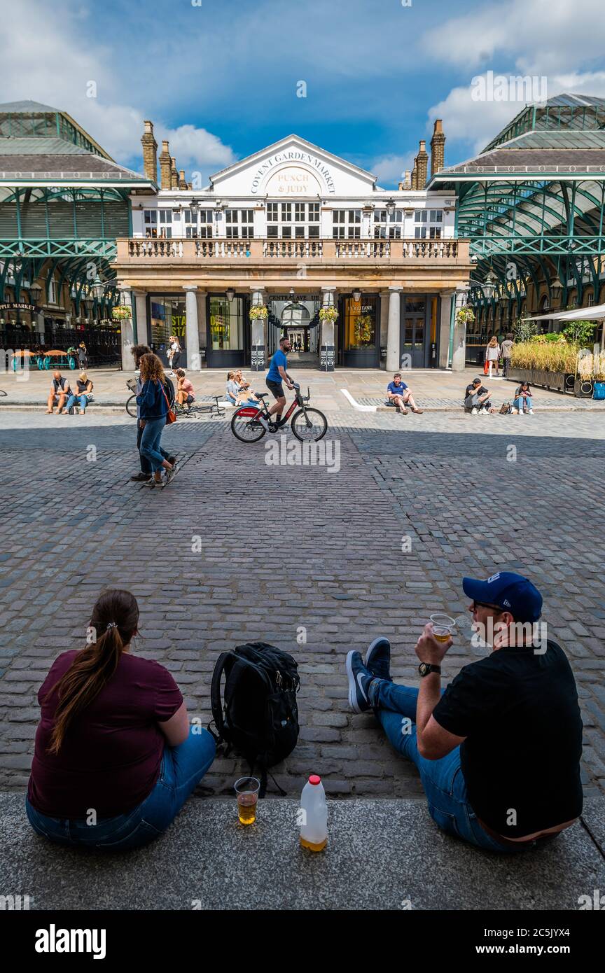 London, UK. 03rd July, 2020. Covent Garden prepares for the new re-opening on July $th (tomorrow) with signage and hand sanitiser - albeit many places are already open, if only partially. The city opens up following the easing of Coronavirus (COVID-19) lock-down. Credit: Guy Bell/Alamy Live News Stock Photo