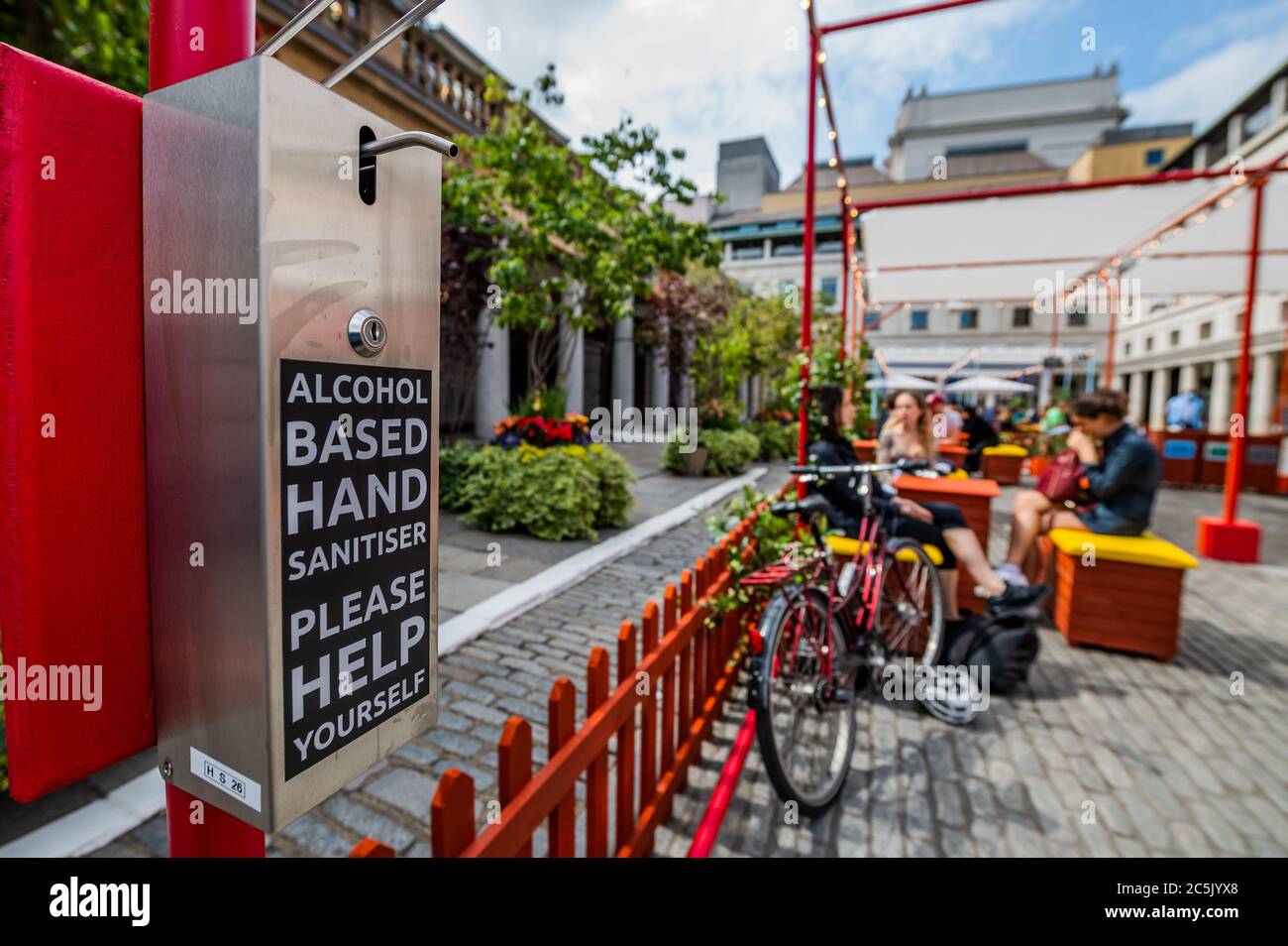 London, UK. 03rd July, 2020. Covent Garden prepares for the new re-opening on July $th (tomorrow) with signage and hand sanitiser - albeit many places are already open, if only partially. The city opens up following the easing of Coronavirus (COVID-19) lock-down. Credit: Guy Bell/Alamy Live News Stock Photo