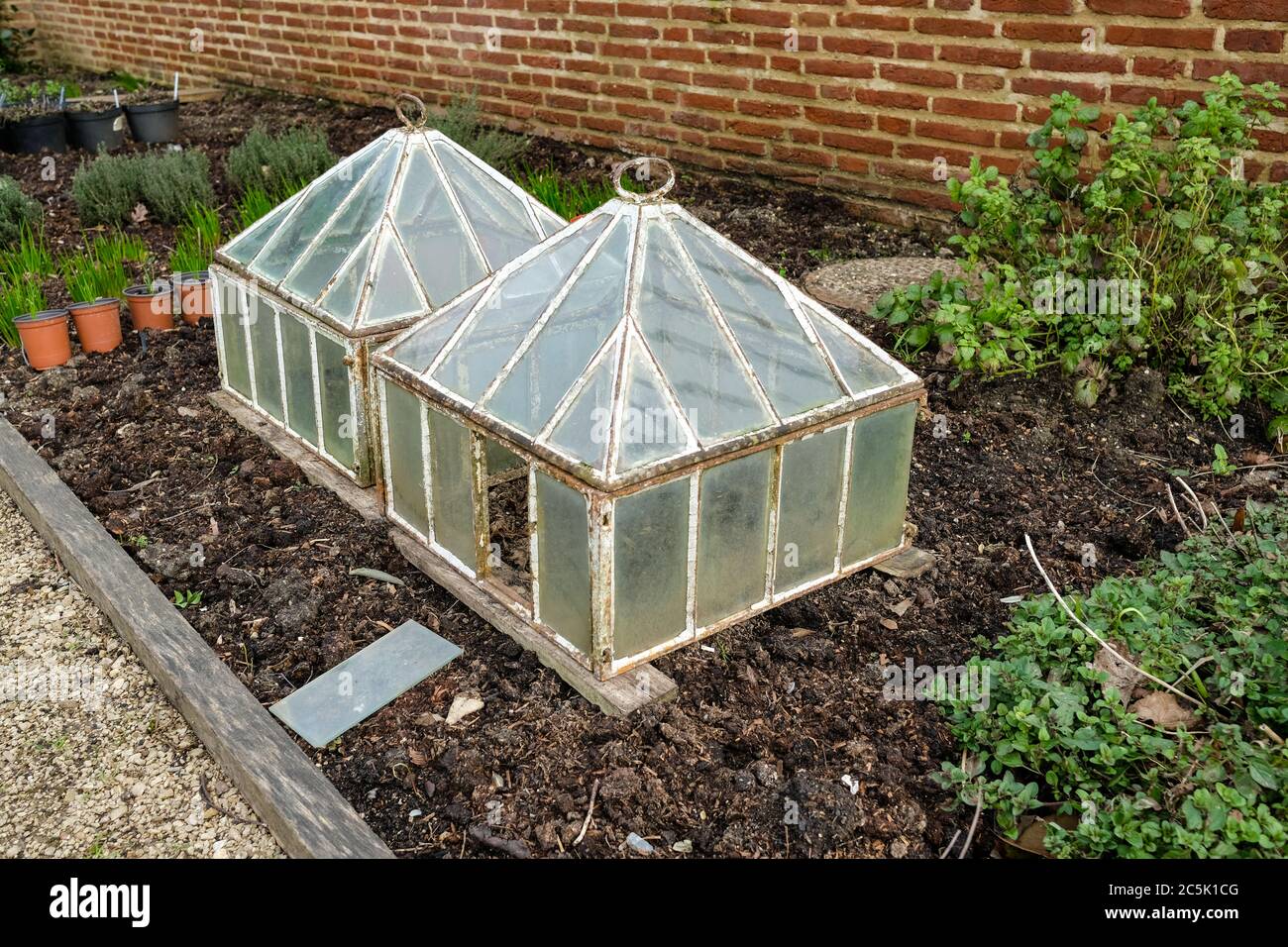 Ornate, oldstyle cold frames seen on an outside allotment plot