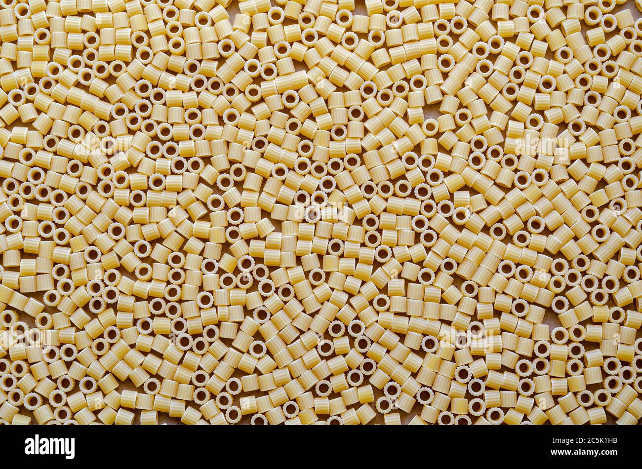 Texture of the dry pasta Ditalini. Italian traditional food. Variety of