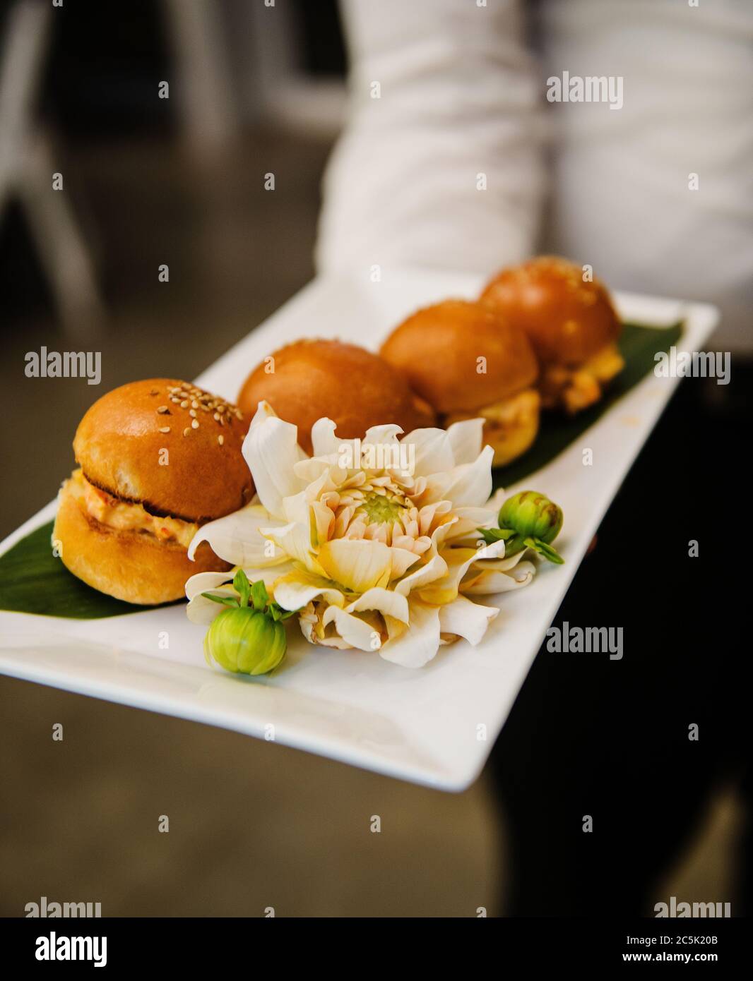 hors d'oeuvres sandwiches being served at an event Stock Photo