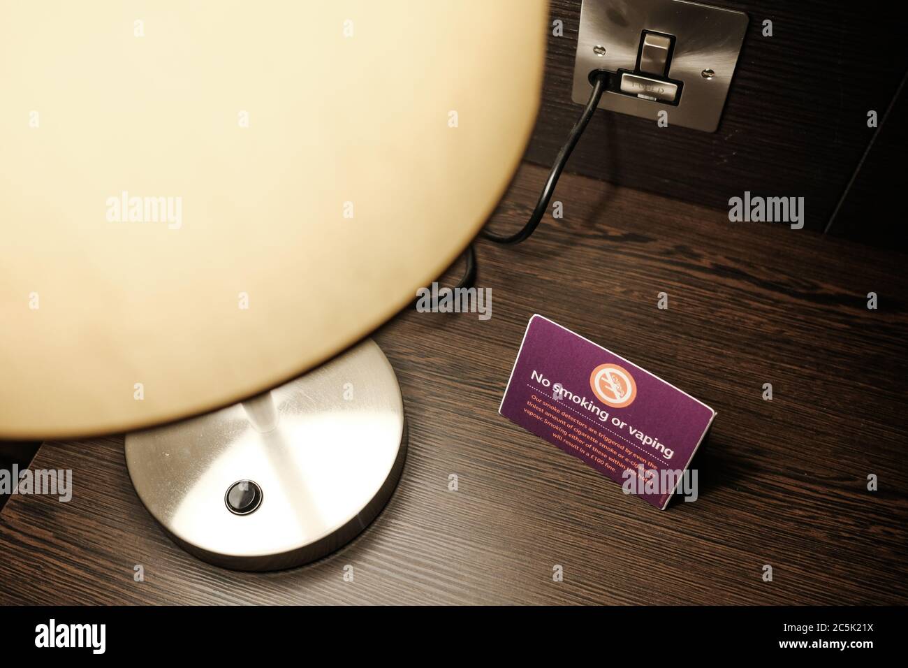 Vaping sign seen on a work desk with a premiumpriced hotel room. The