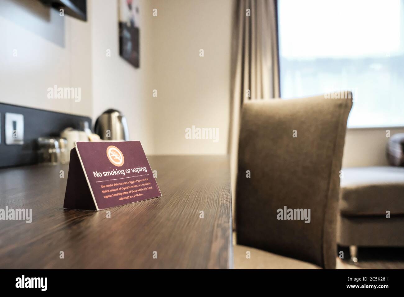 hotel room with clear vaping policy signage