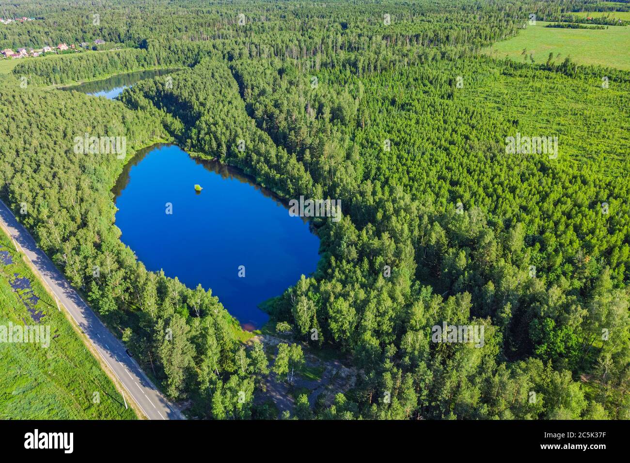 Aerial view from a drone of a lake in a forest Stock Photo - Alamy
