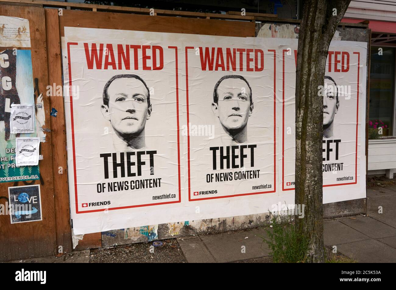 Wanted posters for Mark Zuckerberg, co-founder of Facebook, on Main Street, Vancouver, BC, Canada Stock Photo