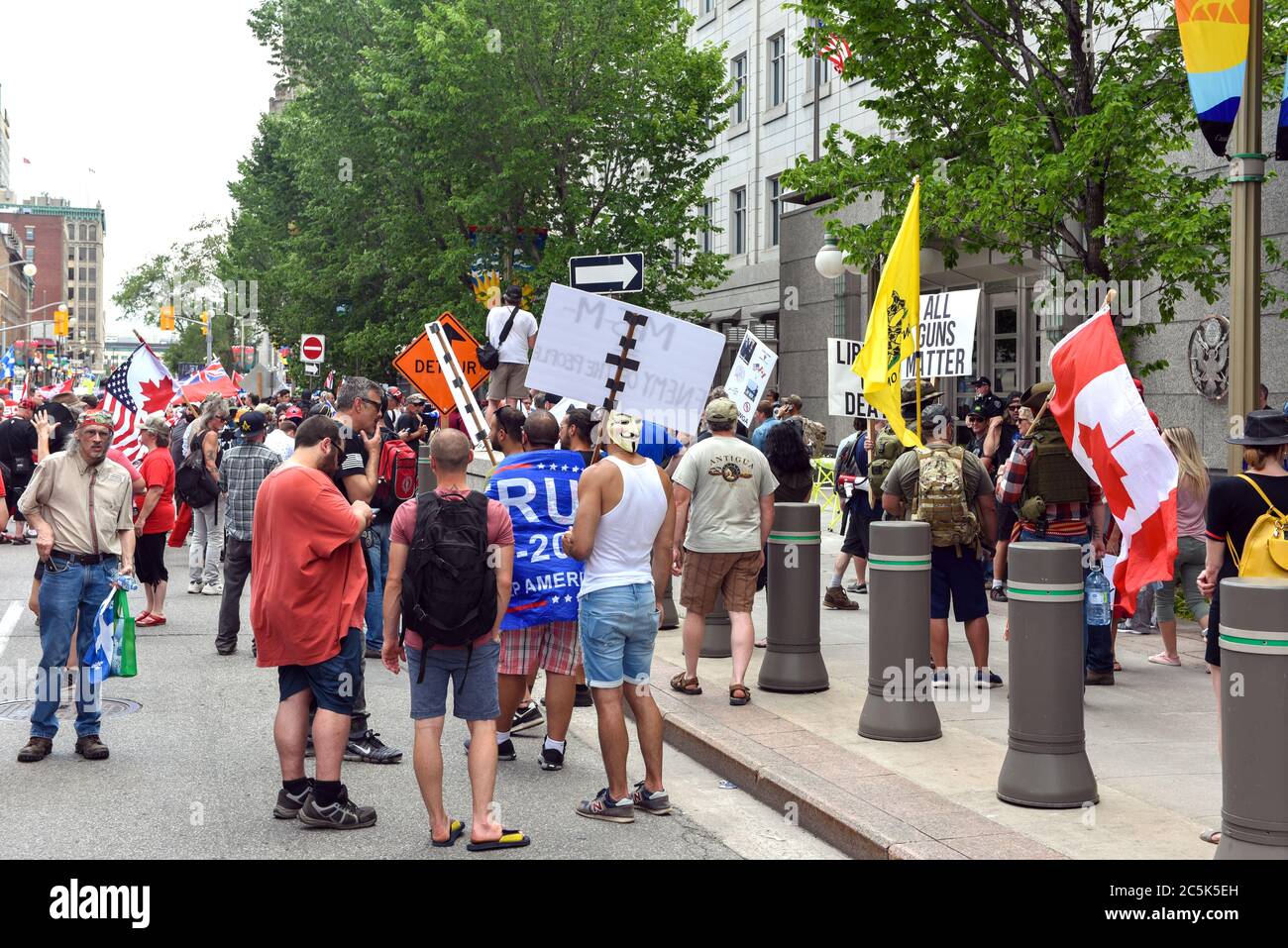 Ottawa, Canada - July 1, 2020: Right wing, pro-gun and covid lockdown protesters protest in front of the US Embassy. The annual Canada Day festivities were cancelled due to the Coronavirus pandemic so many used the opportunity to protest their causes on Parliament Hill and the Embassy. Stock Photo