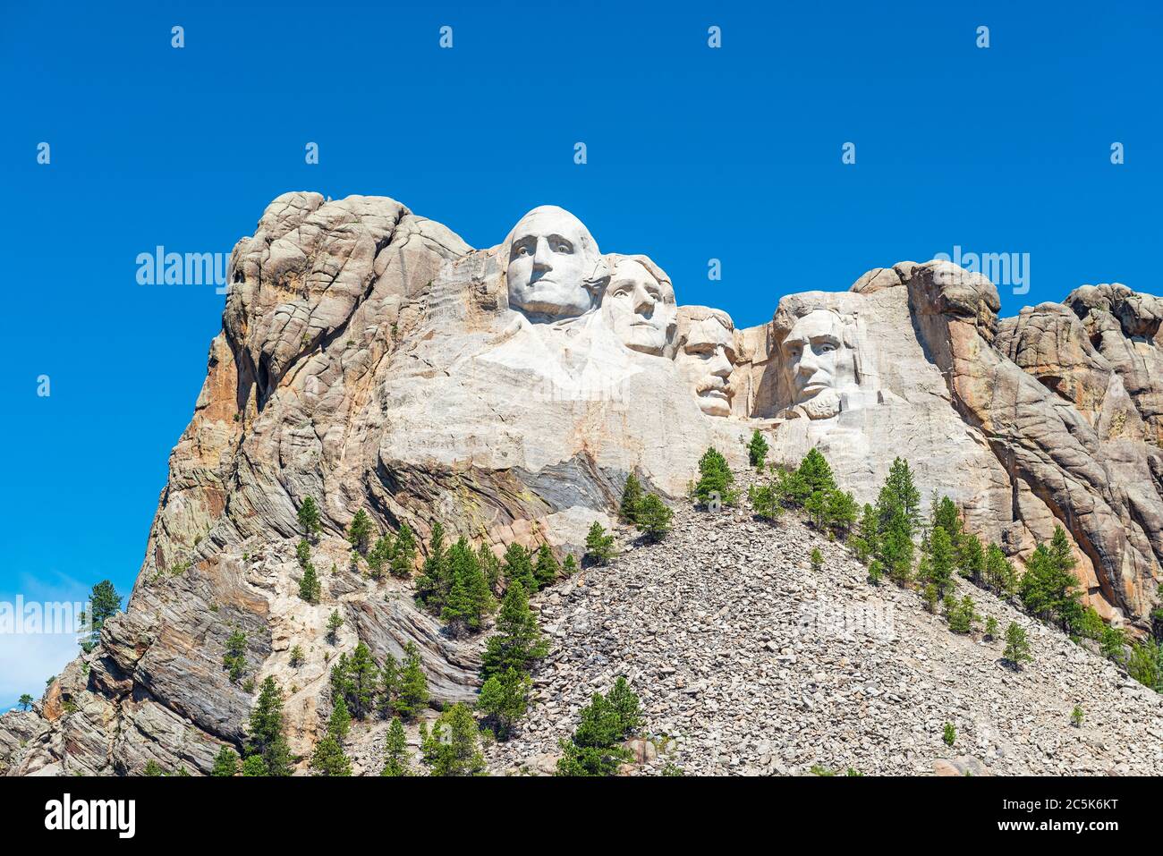 Wide angle view of Mount Rushmore national monument with surrounding forest and nature near Rapid City in South Dakota, United States of America, USA. Stock Photo
