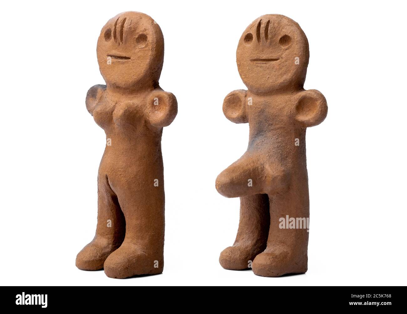 Ancient clay male and female figurines from Canary Islands isolated on