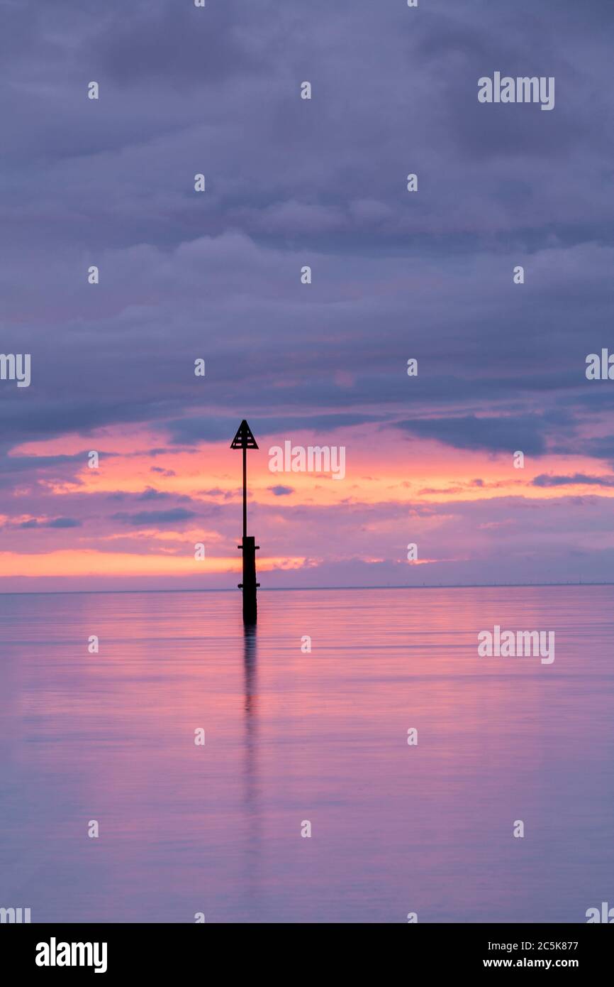 Wooden post at Llandudno, North Wales coast Stock Photo