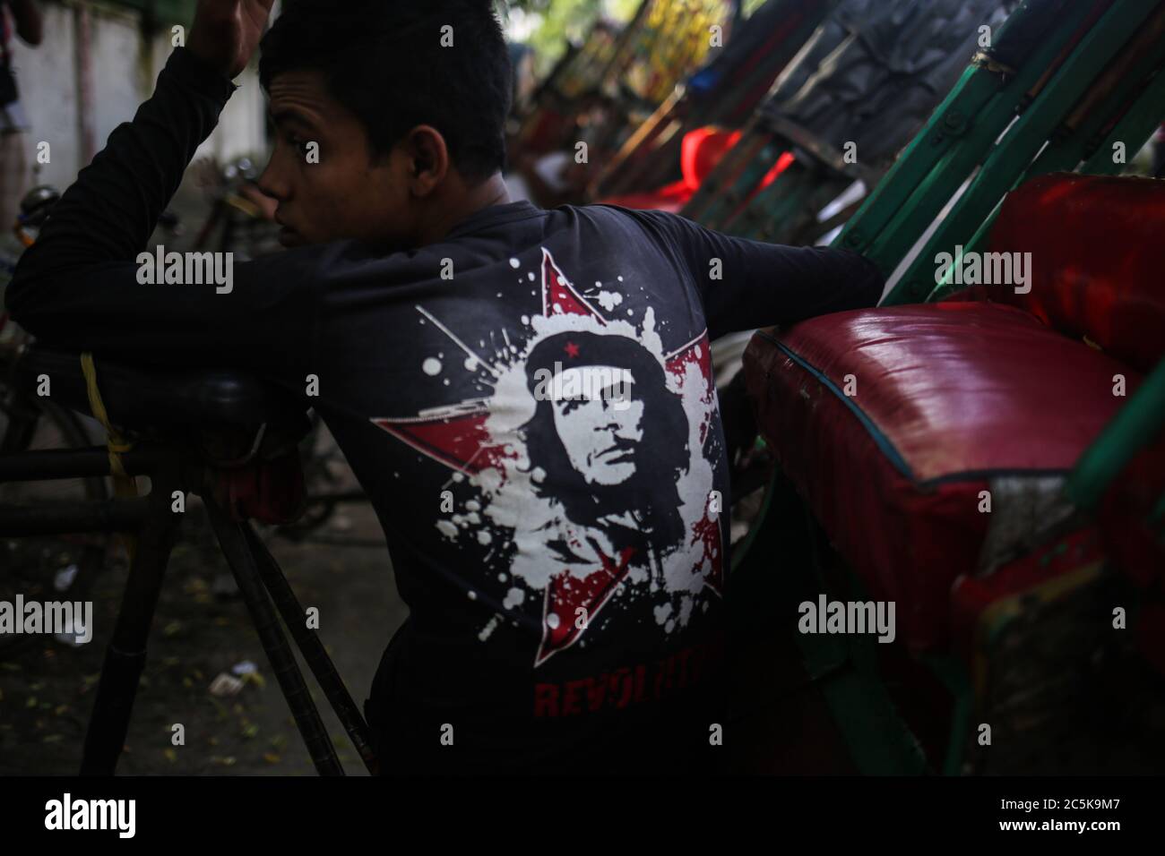 Dhaka, Dhaka, Bangladesh. 3rd July, 2020. A man is sitting on his ride wearing Che Guevara t-shirt. Credit: Md. Rakibul Hasan/ZUMA Wire/Alamy Live News Stock Photo