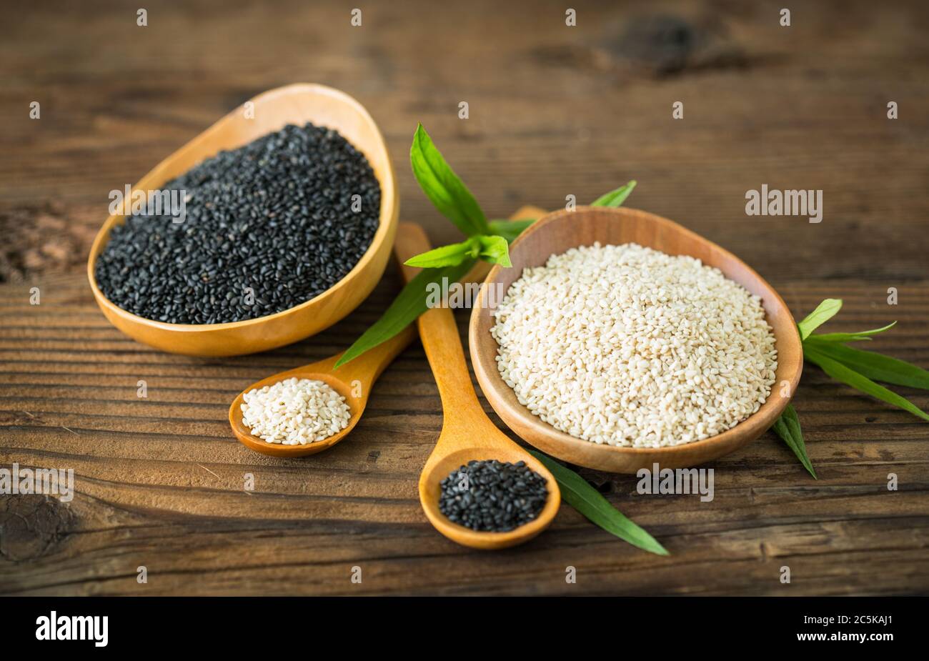 Black and white sesame seed in the wooden bowl Stock Photo Alamy