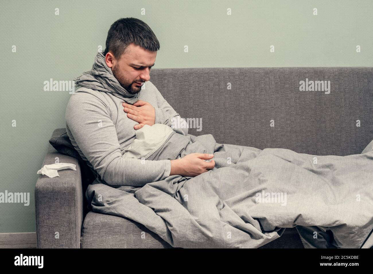 Disease. Cheer at home. A young man is sick, is treated at home. Chest
