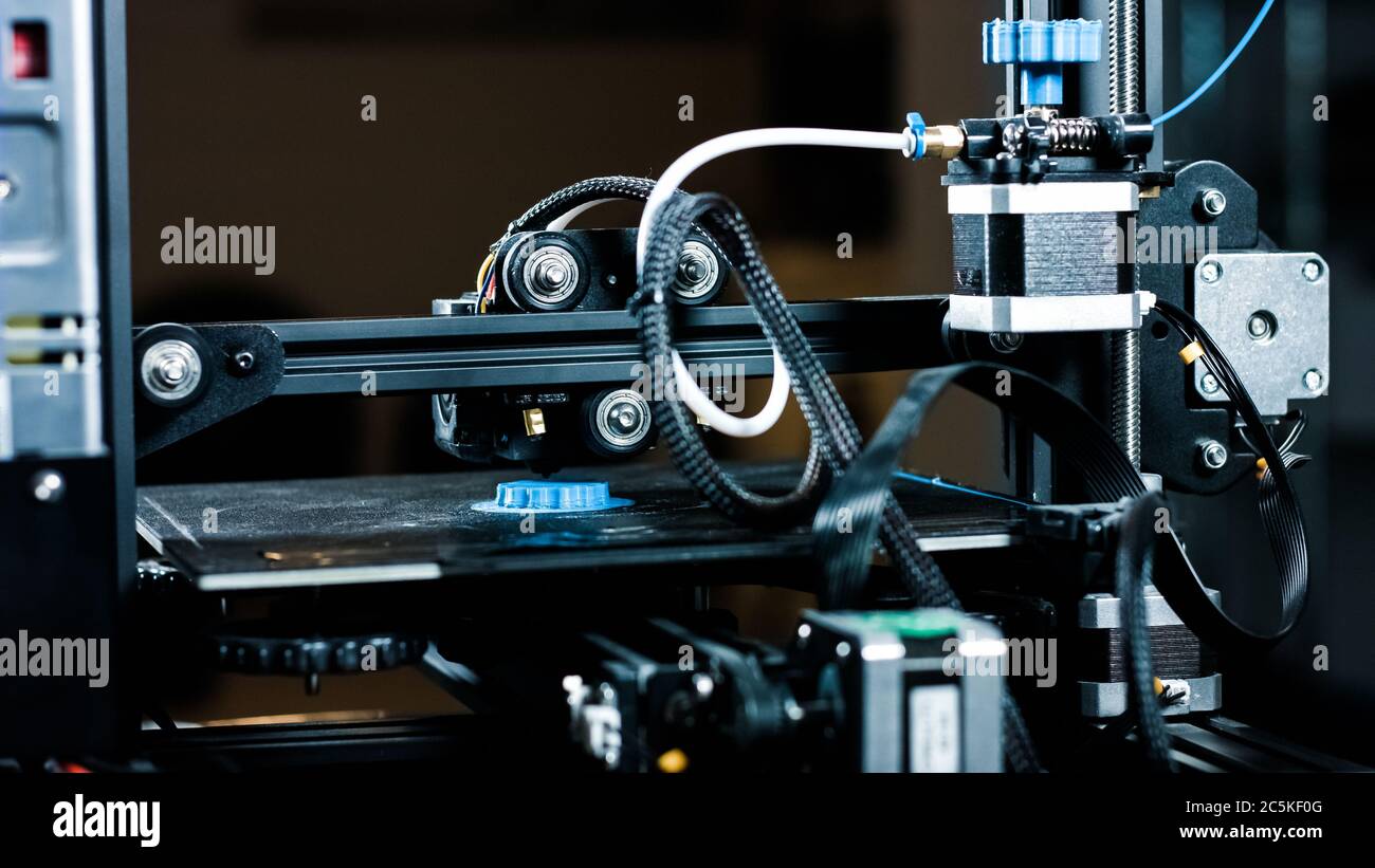 3D plastic printer during work in a factory three dimensional printing. Close-up detail. Stock Photo