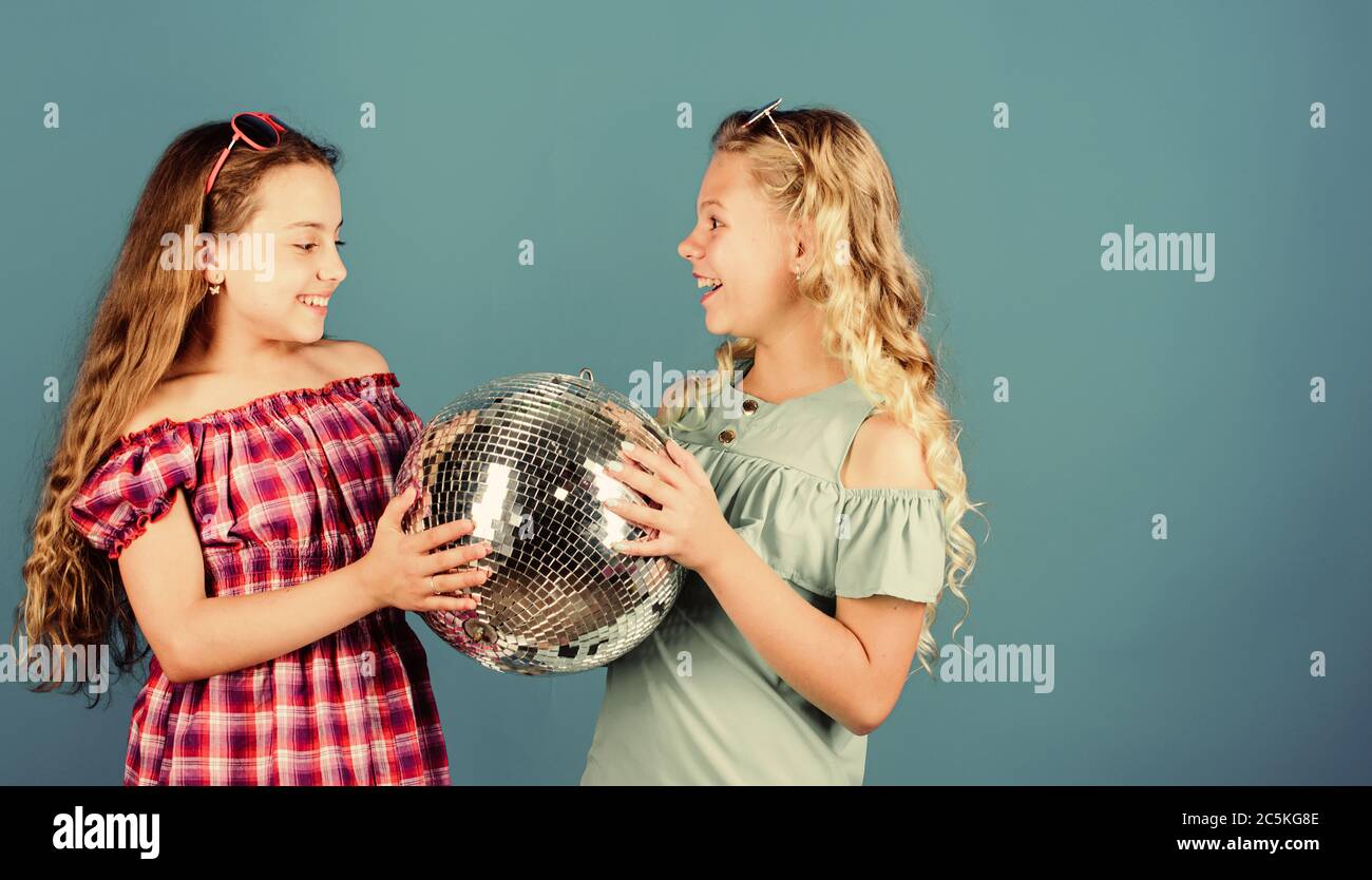 Lets start party. Cheerful kids hold disco ball. Disco dances. Retro music. Mirrors reflecting