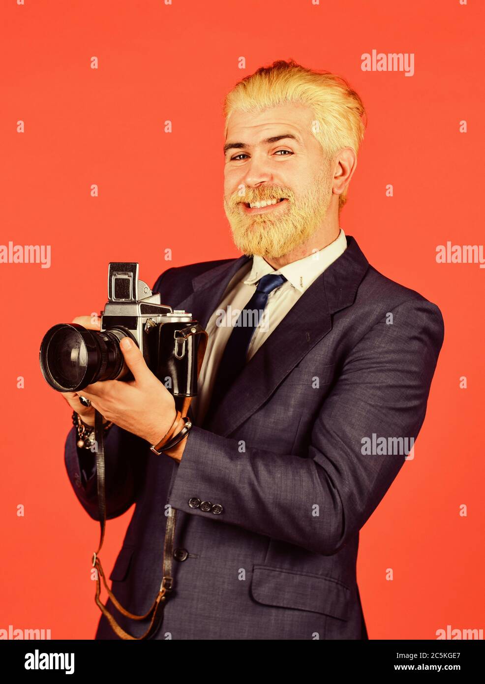 Photographer hold retro camera. Connoisseur of vintage values. Classy and old  school. Manual settings. Photographer with blond beard and mustache.  Content creator. Man bearded hipster photographer Stock Photo - Alamy