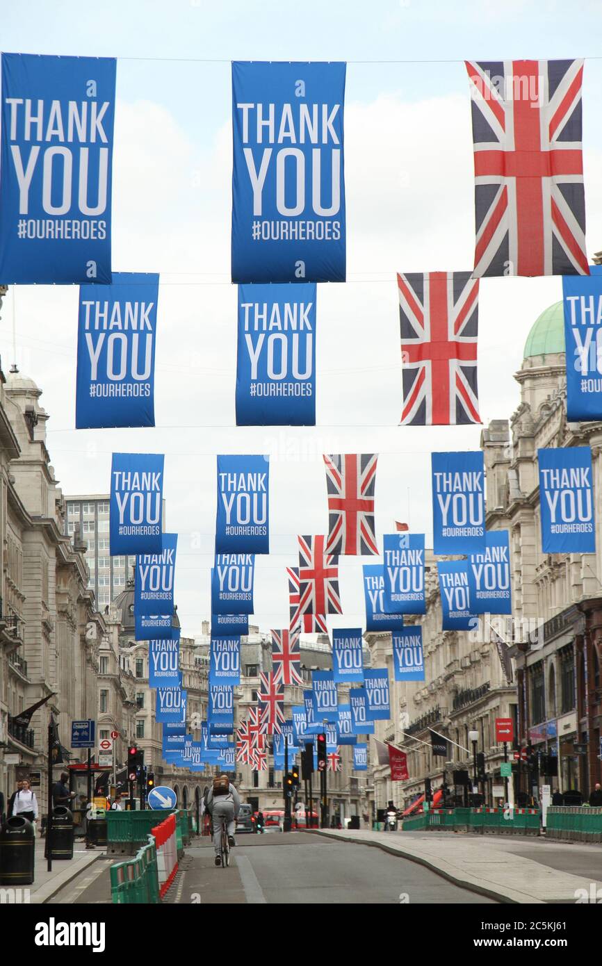 Flags drapped on Rgents street thanking Key workers who have seen the UK through the Covid19 lockdown. Daily life in London on a friday ahead of the opening of pubs on the 4th of July as per new Government advice. Stock Photo