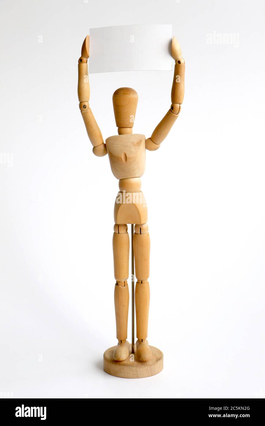 Isolated wood mannequin holding a blank sign Stock Photo