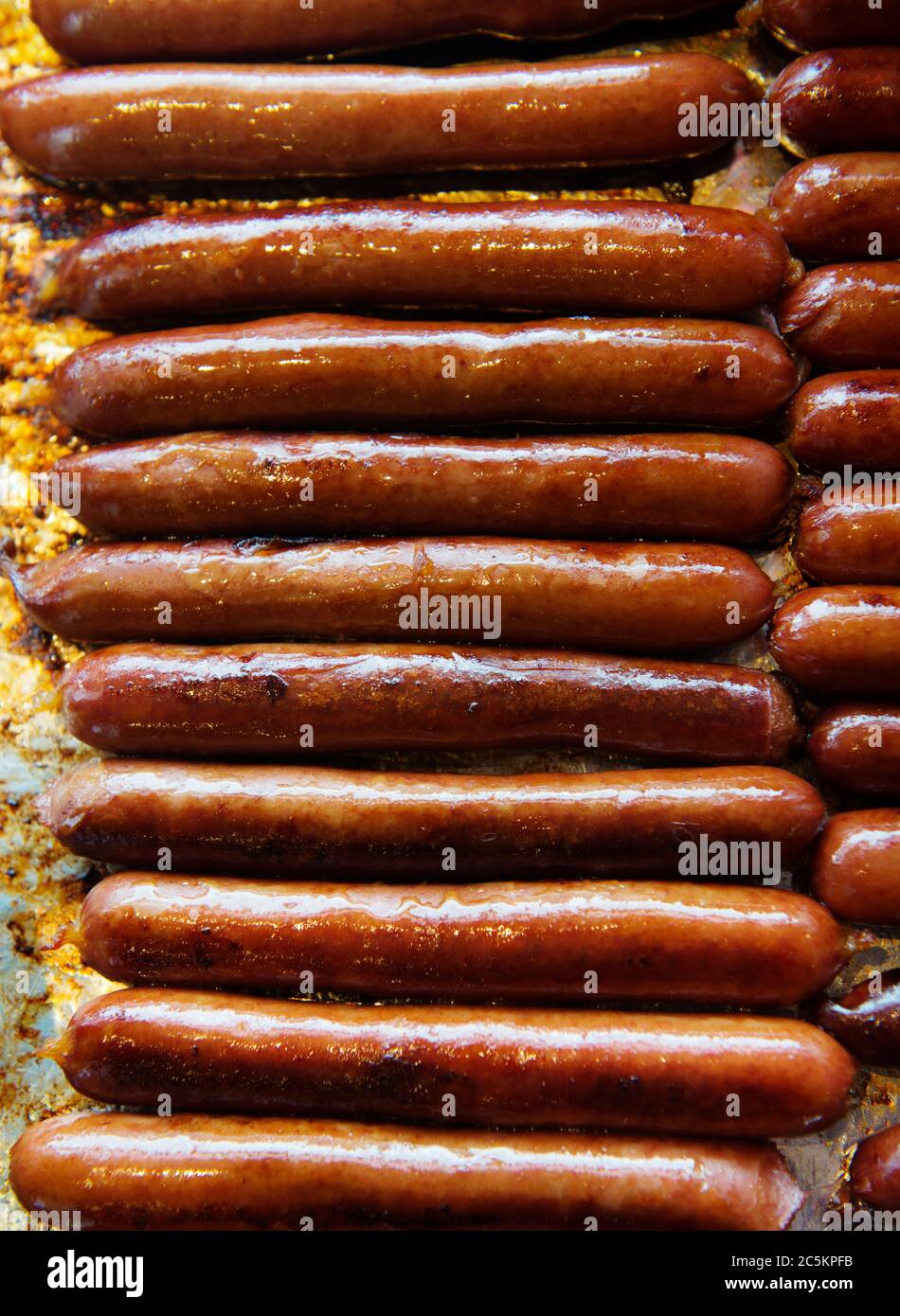 Hot dogs being cooked at a deli Stock Photo