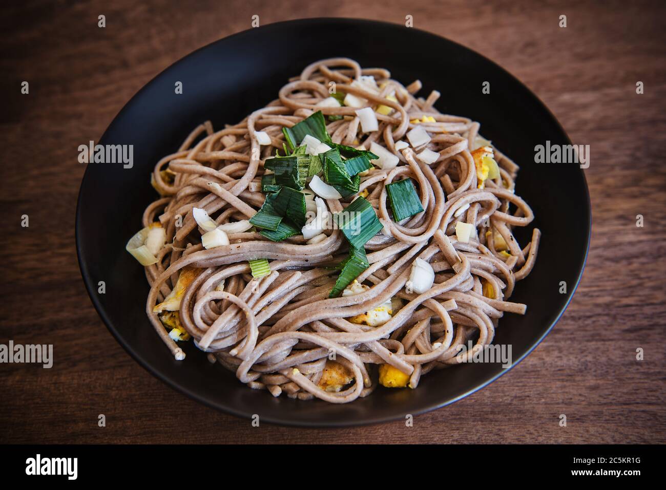 Bhutanese Buckwheat noodles with chives and fried egg Stock Photo Alamy