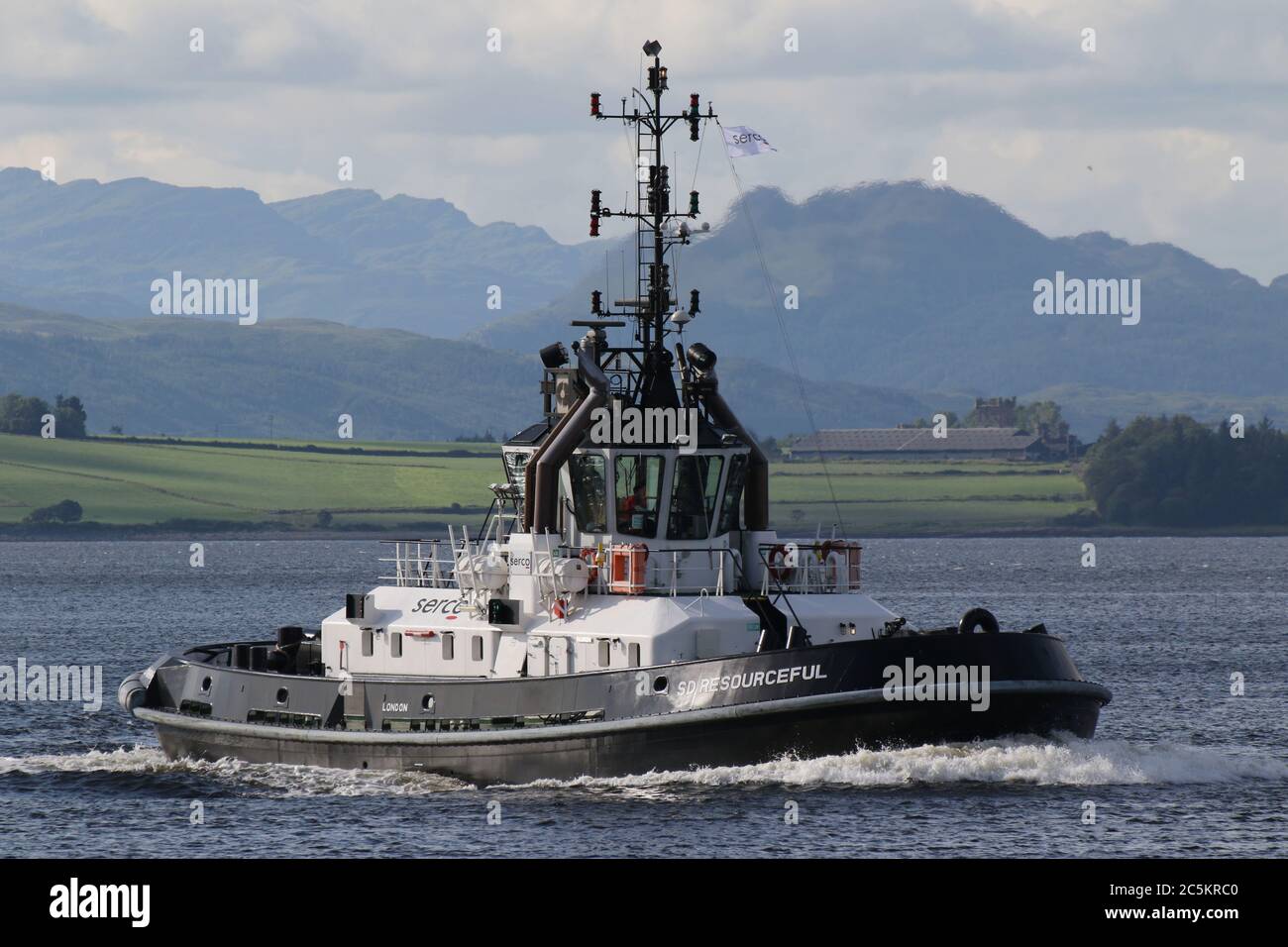 SD Resourceful, an ATD 2909-class tug operated by Serco Marine Services, passes East India Harbour in Greenock. Stock Photo