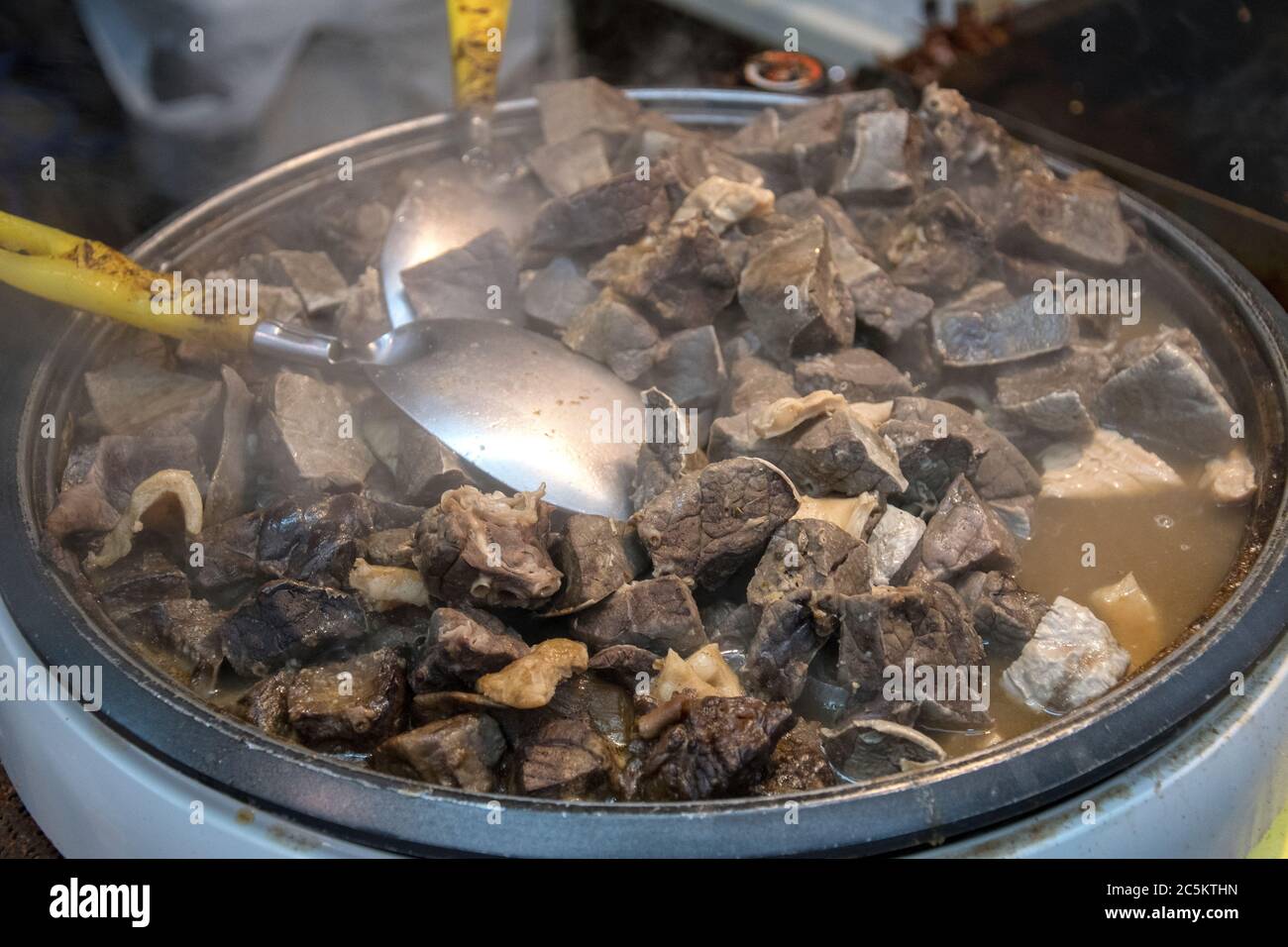 Beef offal stew sold at Kuromon market in Osaka city, Japan Stock Photo