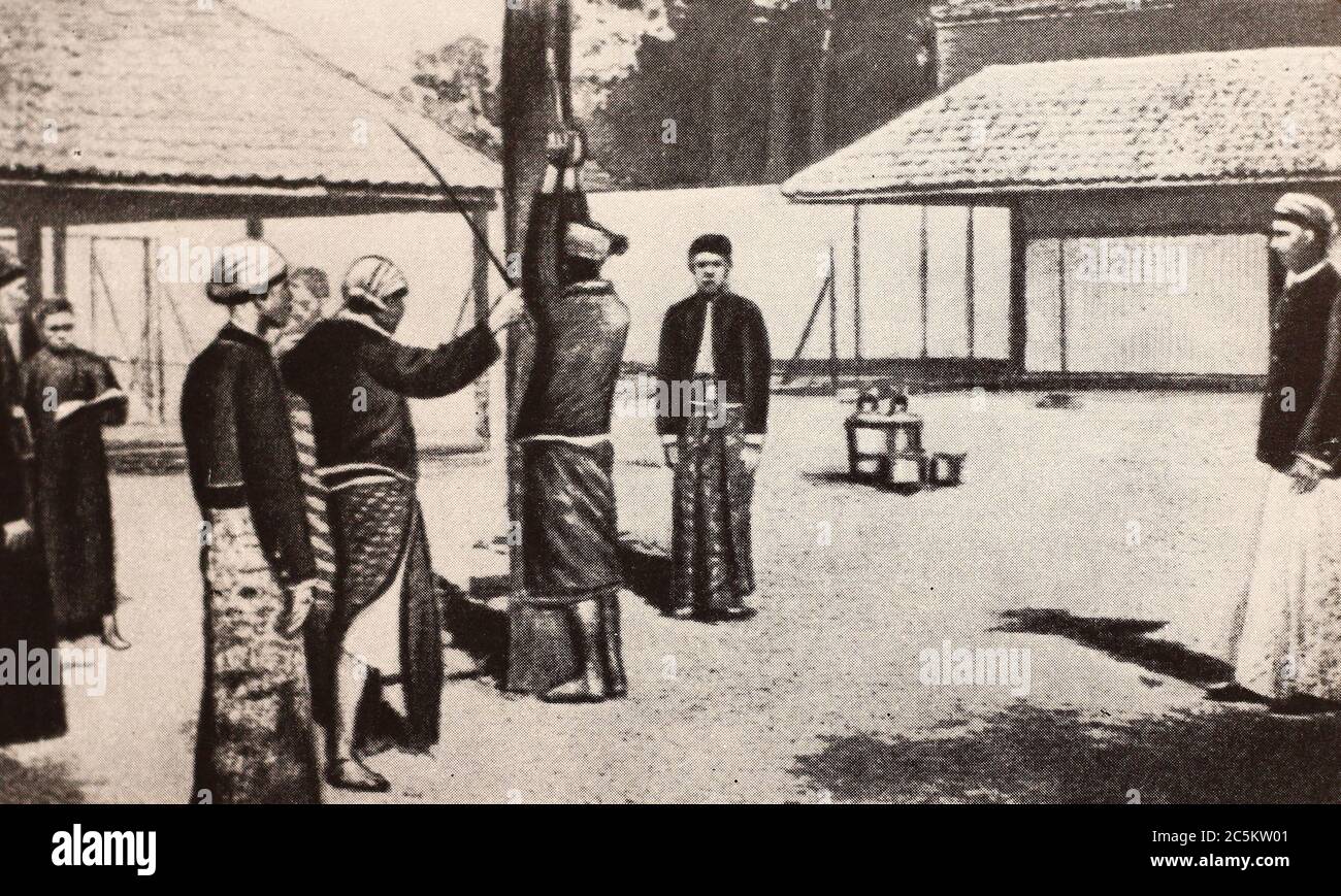 The punishment of the contracted in Sumatra. Photo of the beginning of the 20th century. Stock Photo