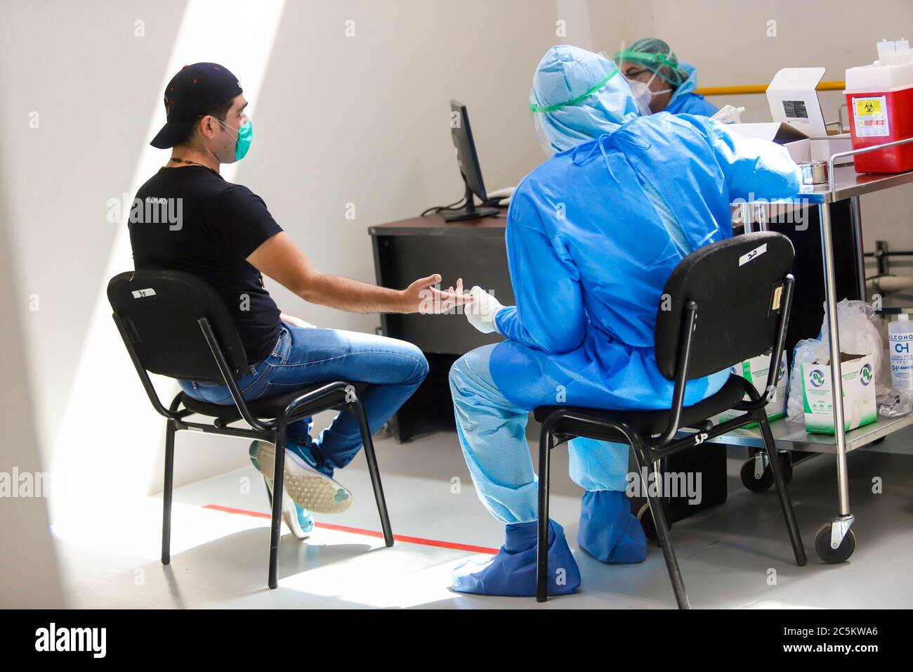 HERMOSILLO, MEXICO - JULY 3:A man is attended by health personnel who perform a rapid Covid-19 detection test during a health day held at the Arena Sonora  on July 3, 2020 in Hermosillo, Mexico. (Luis Gutierrez/Norte Photo) Stock Photo