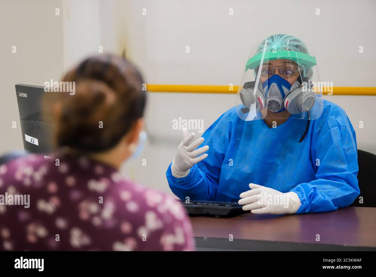 HERMOSILLO, MEXICO - JULY 3:A woman is attended by health personnel who perform a rapid Covid-19 detection test during a health day held at the Sonora Arena on July 3, 2020 in Hermosillo, Mexico. (Luis Gutierrez/Norte Photo/) Stock Photo