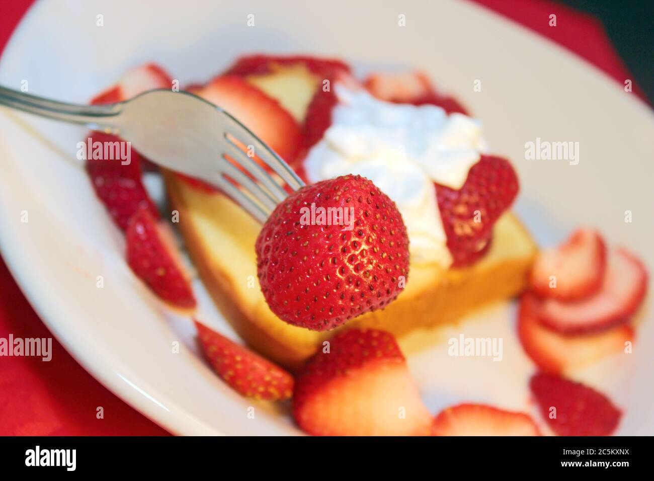 Cake with fresh sliced strawberries and whipped topping Stock Photo Alamy