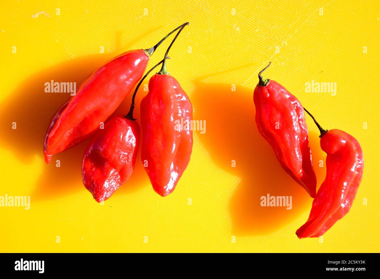 Red hot chilli peppers on the table Stock Photo - Alamy