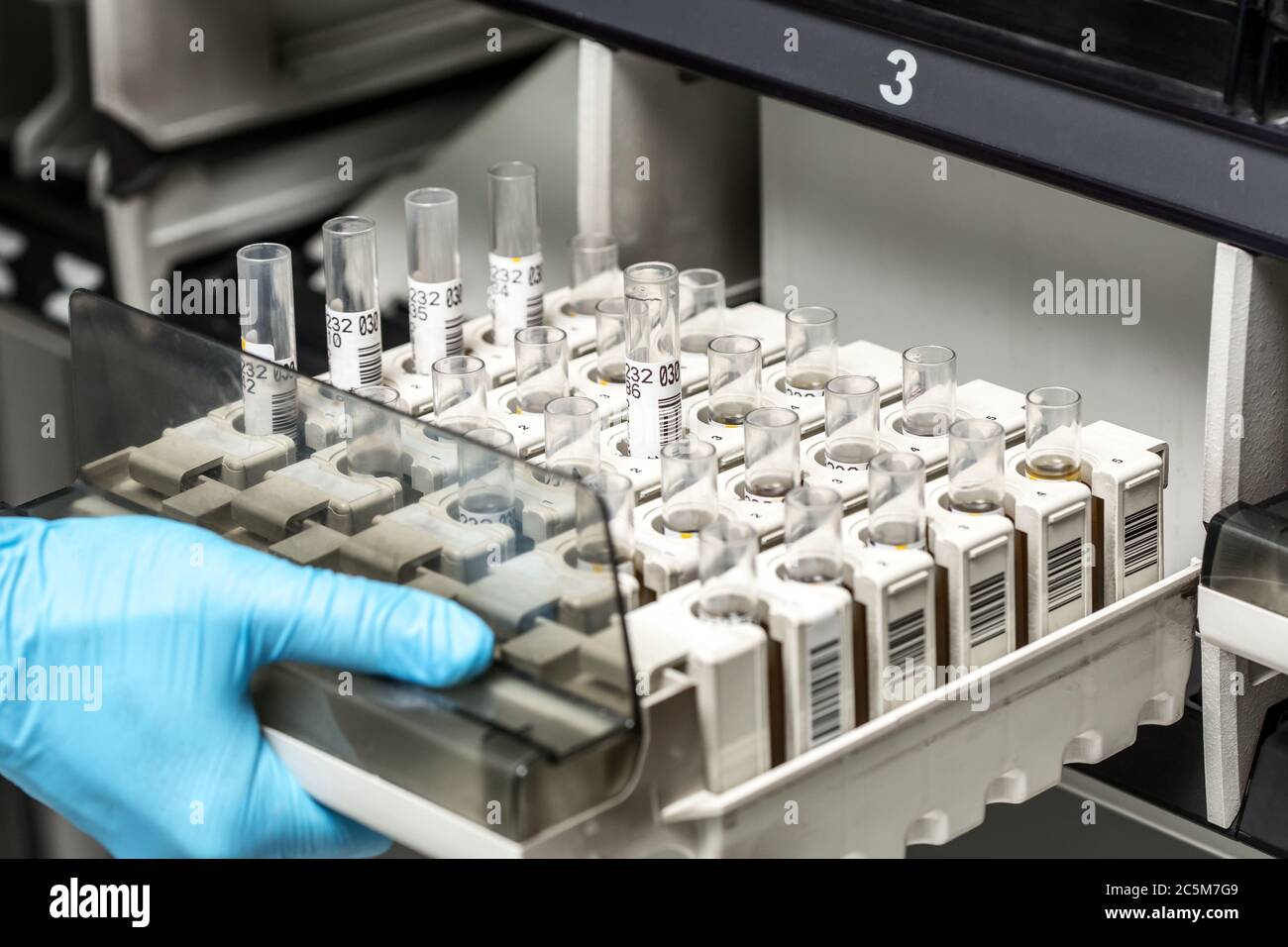 A chemical sample bottle. Centrifuge. A test tube vial sets for