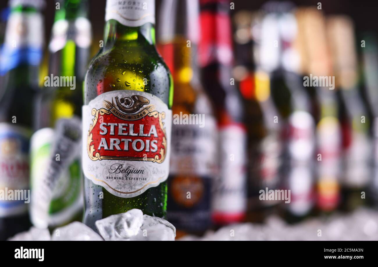 POZNAN, POL - DEC 23, 2019: Bottles of famous global beer brands including Heineken, Becks, Bud, Miller, Corona, Stella Artois, and Pilsner Urquell Stock Photo