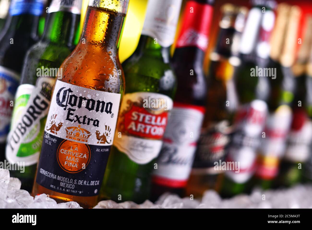 POZNAN, POL - DEC 23, 2019: Bottles of famous global beer brands including Heineken, Becks, Bud, Miller, Corona, Stella Artois, and Pilsner Urquell Stock Photo