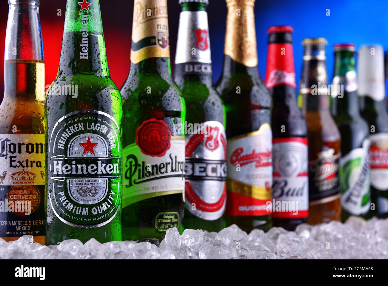 POZNAN, POL - DEC 23, 2019: Bottles of famous global beer brands including Heineken, Becks, Bud, Miller, Corona, Stella Artois, and Pilsner Urquell Stock Photo