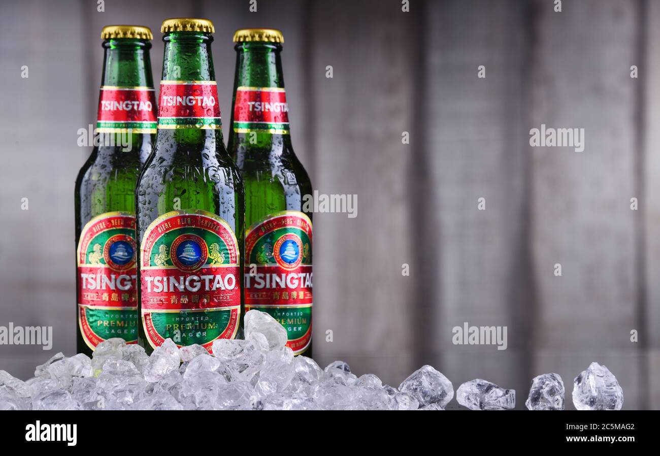 POZNAN, POL JAN 10, 2020 Bottles of Tsingtao beer, product of