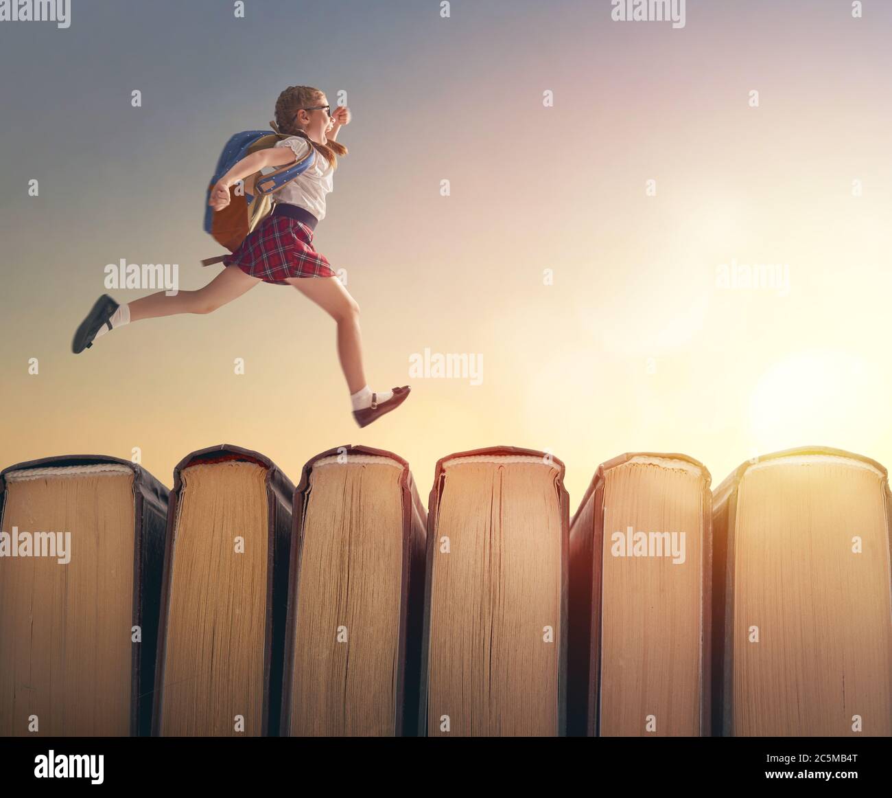 Back To School Happy Cute Industrious Child Are Running On Books On Background Of Sunset Landscape Concept Of Education And Reading The Development Stock Photo Alamy Back To School Happy Cute Industrious Child Are Running On Books On Background Of Sunset Landscape Concept Of Education And Reading The Development Stock Photo Alamy
