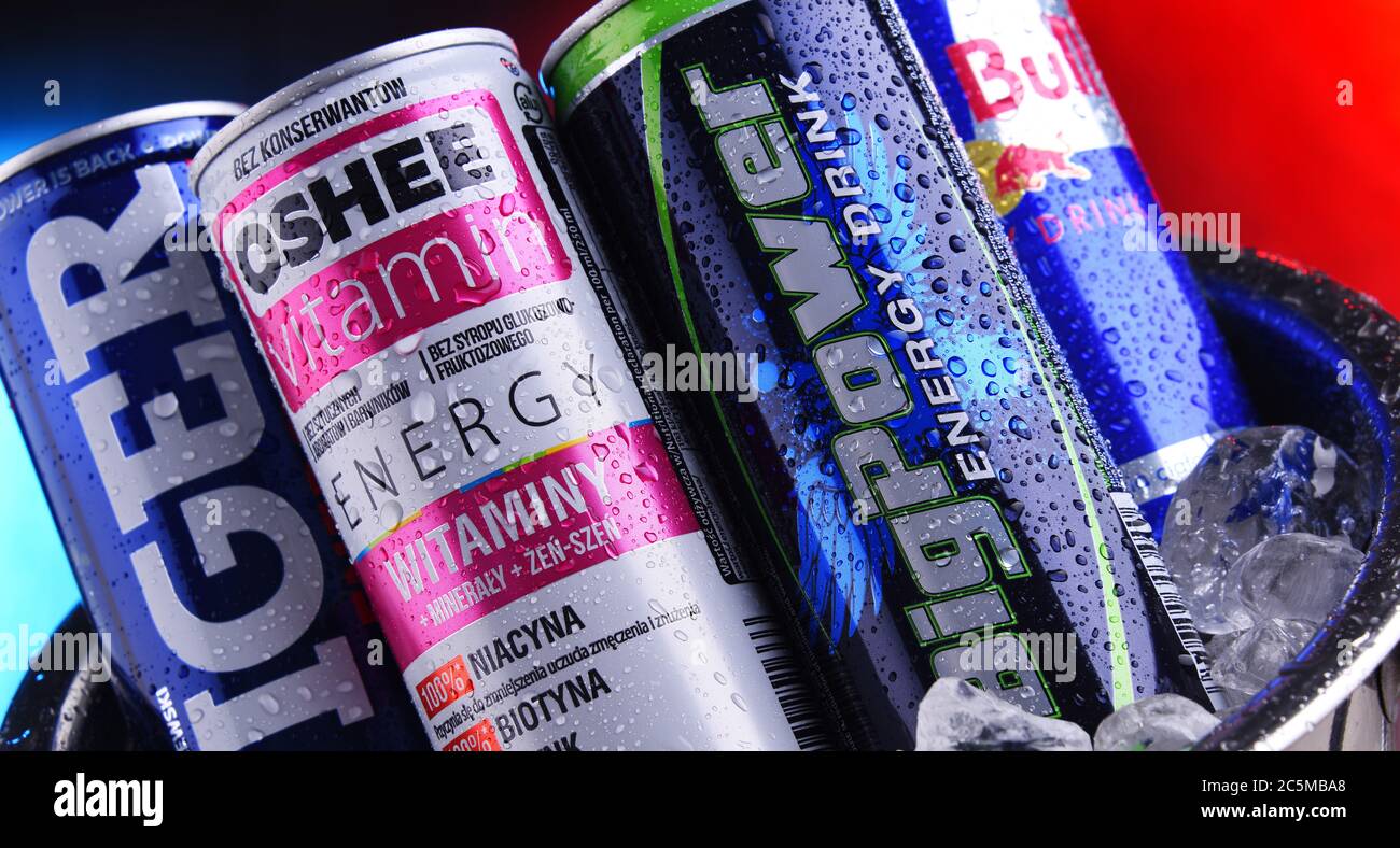 POZNAN, POLAND - JAN 29, 2020: Cans of popular global energy drinks, beverages containing stimulant drugs and marketed as providing mental and physica Stock Photo