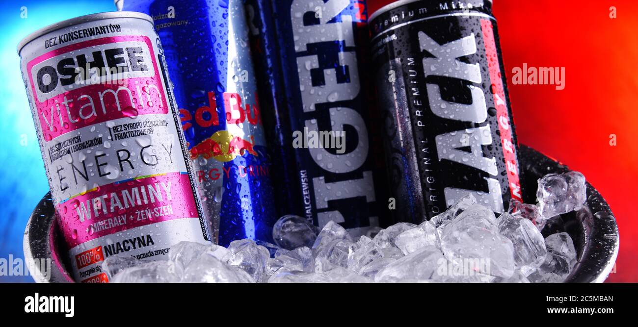 POZNAN, POLAND - JAN 29, 2020: Cans of popular global energy drinks, beverages containing stimulant drugs and marketed as providing mental and physica Stock Photo