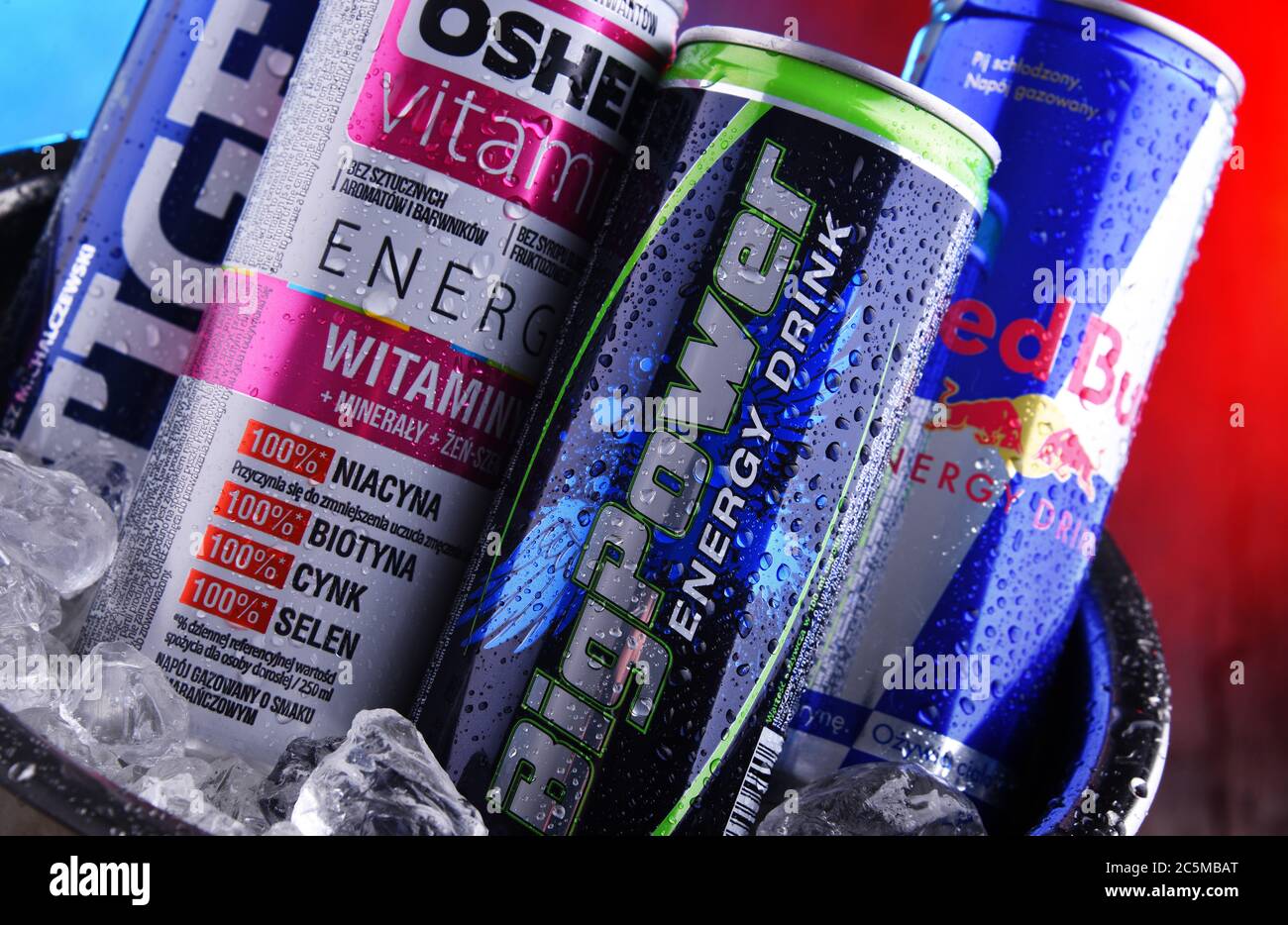 POZNAN, POLAND - JAN 29, 2020: Cans of popular global energy drinks, beverages containing stimulant drugs and marketed as providing mental and physica Stock Photo